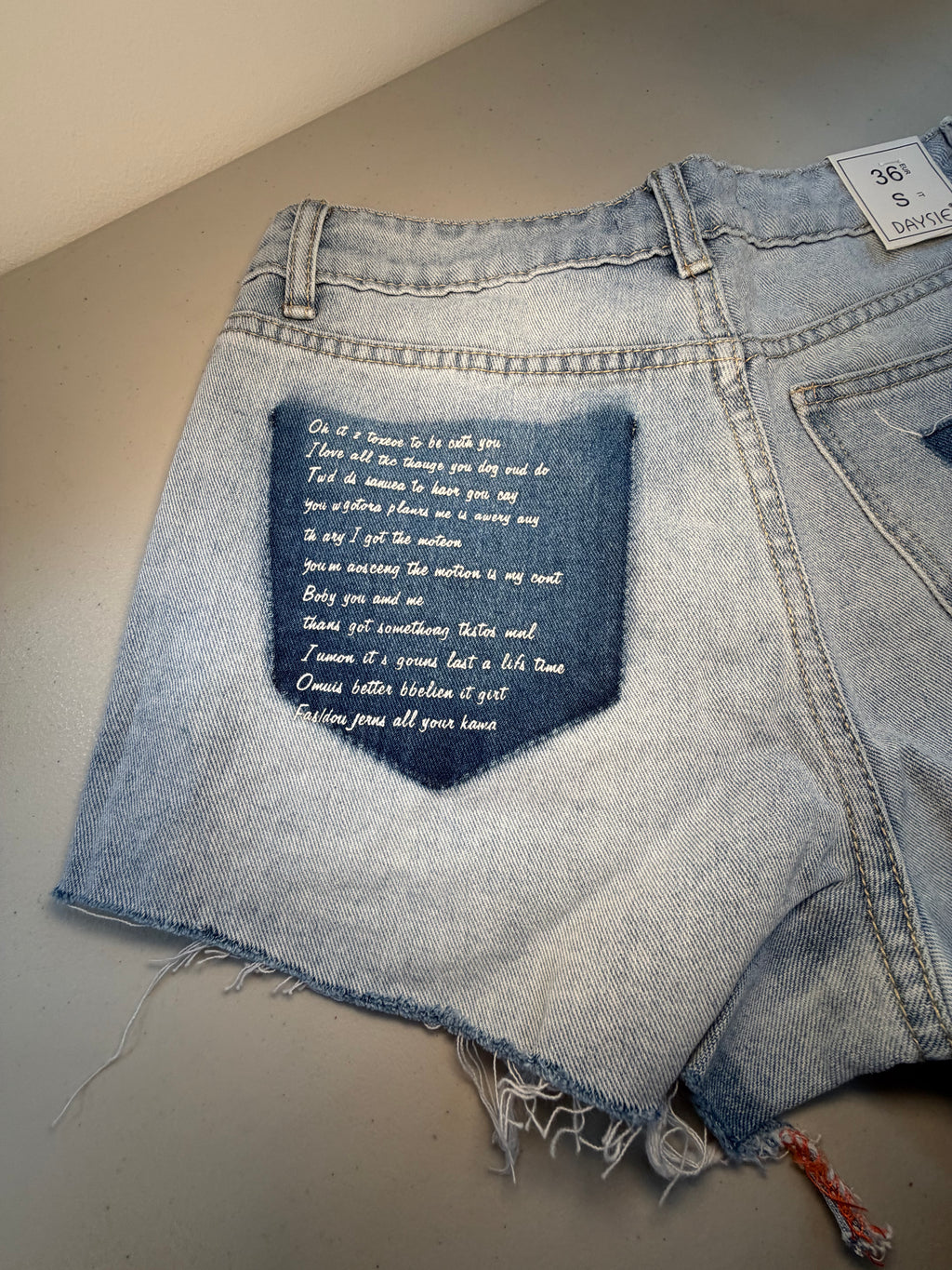Ripped Denim Shorts with Wording on Pocket