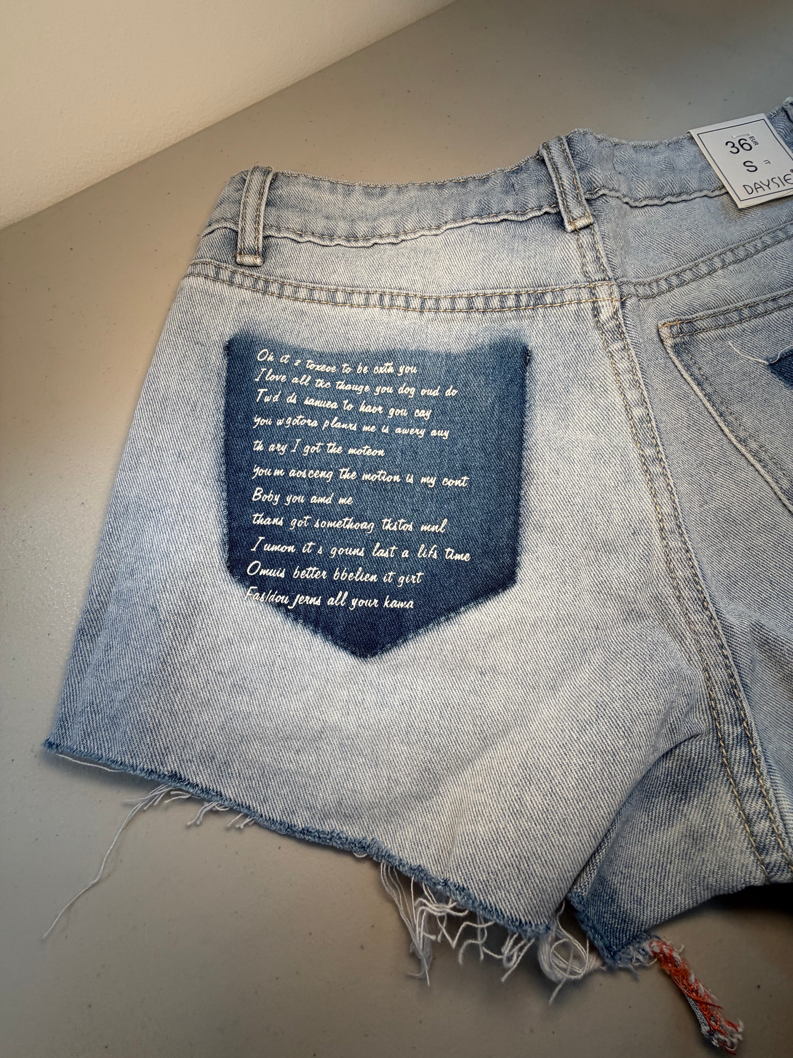 Ripped Denim Shorts with Wording on Pocket