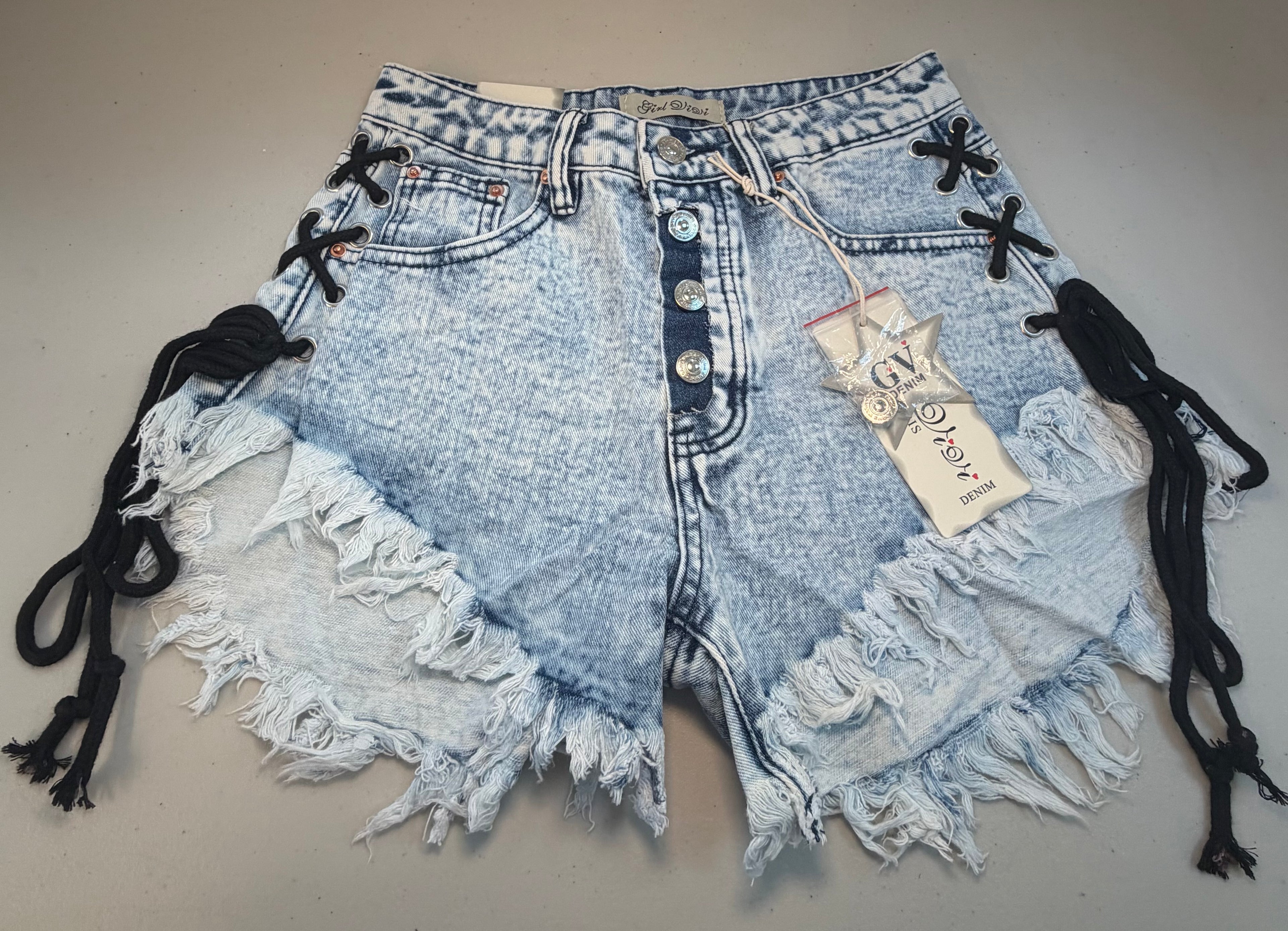 PARIS- Denim shorts with black ties.